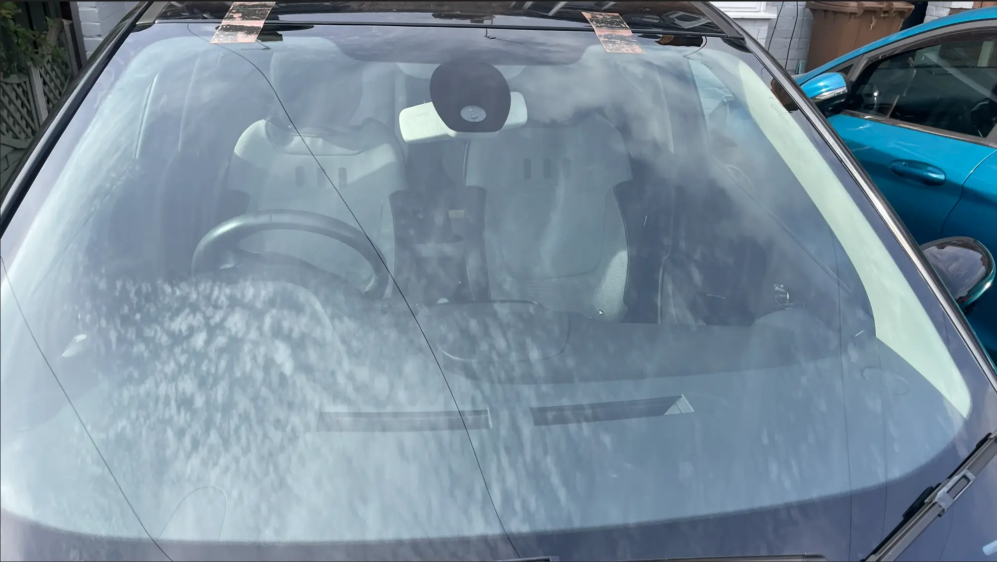 Vehicle glass being prepared for replacement