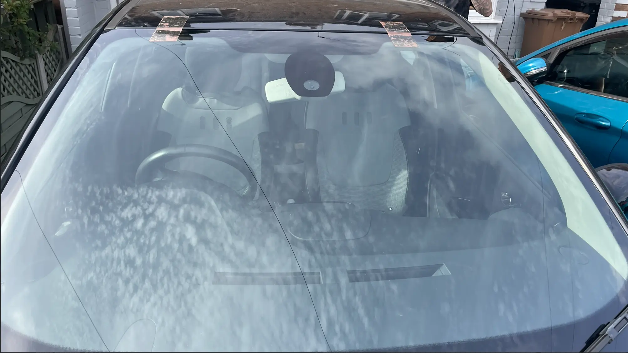 Modern windscreen with camera bracket and sensor housing